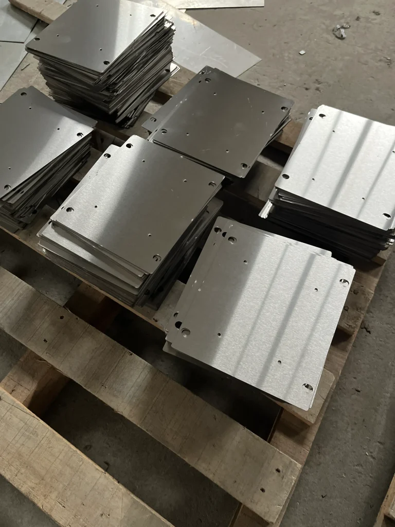 Custom laser cut sheet metal parts with mounting holes for electrical enclosure fabrication