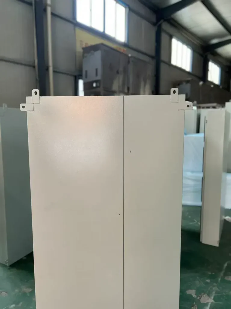 rear view of outdoor electrical cabinet with lifting lugs and sealed steel enclosure structure