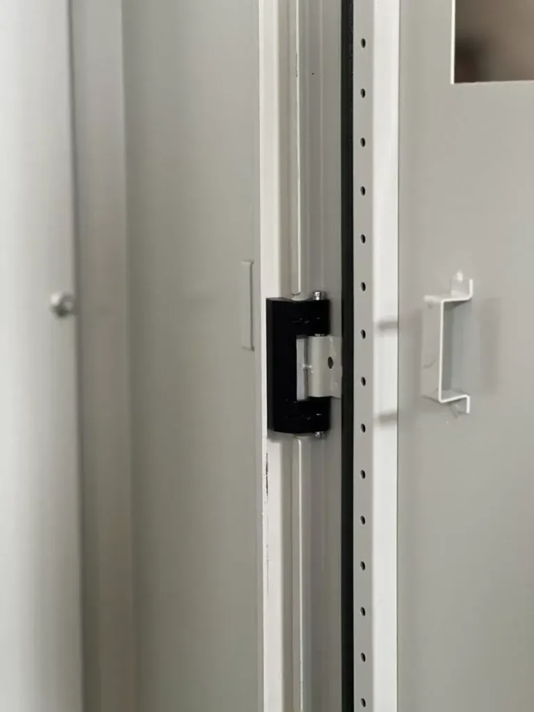 industrial enclosure door hinge and mounting frame detail with heavy duty structure