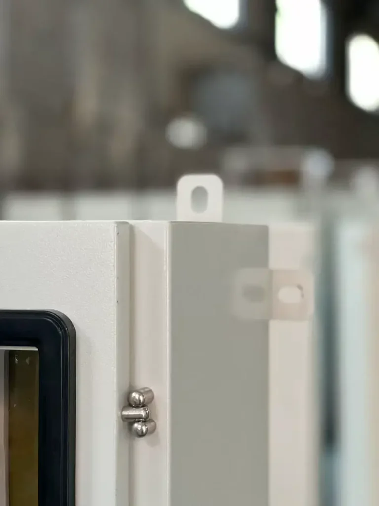 electrical cabinet hinge detail with lifting lug and powder coated steel enclosure structure